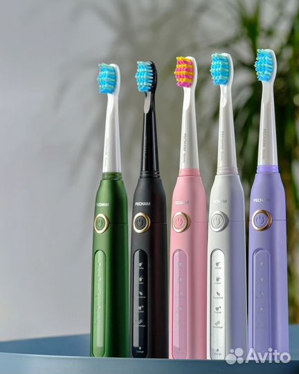 Электрическая зубная щетка