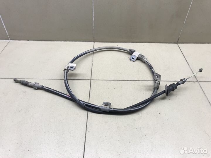 Трос стояночного тормоза левый Outlander (GF) 2012