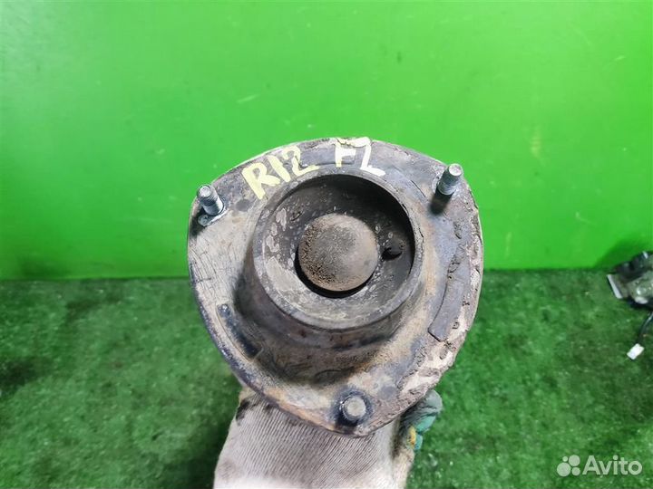 Стойка амортизатора передняя левая KIA Sportage 2