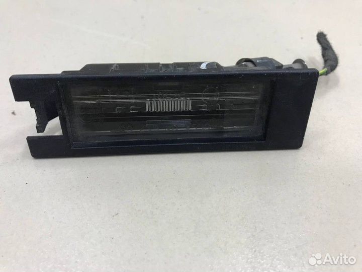 Фонарь подсветки номера Opel Astra