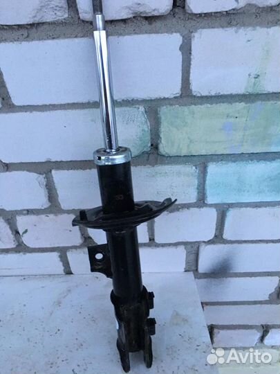 Амортизатор левый mando EX546513X250