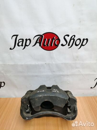 Суппорт передний левый Toyota Corolla 150