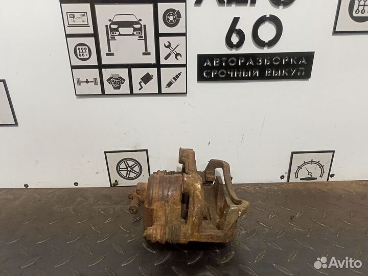 Суппорт тормозной левый Nissan Almera Classiс B10