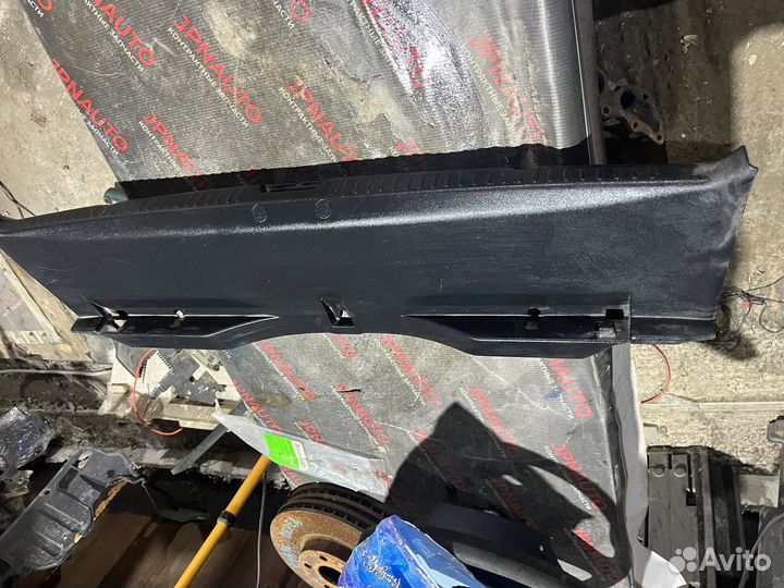 Mitsubishi Lancer 10 накладка панели задка