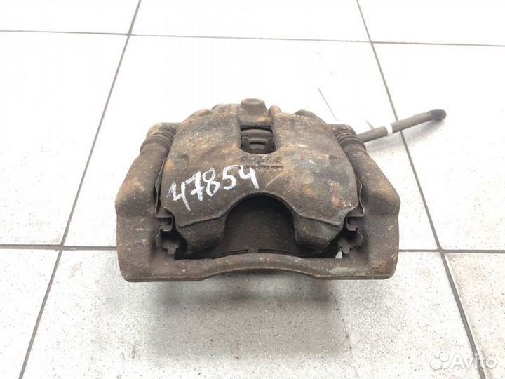 Суппорт тормозной передний левый Nissan Note