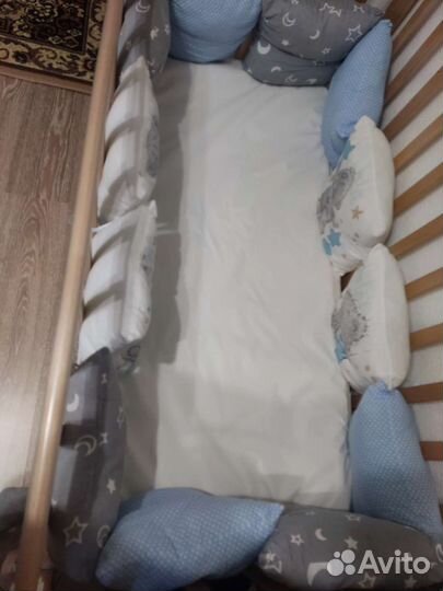 Детская кроватка с продольным маятником