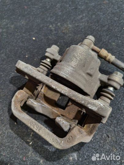 Суппорт тормозной задний левый Nissan X-Trail T31