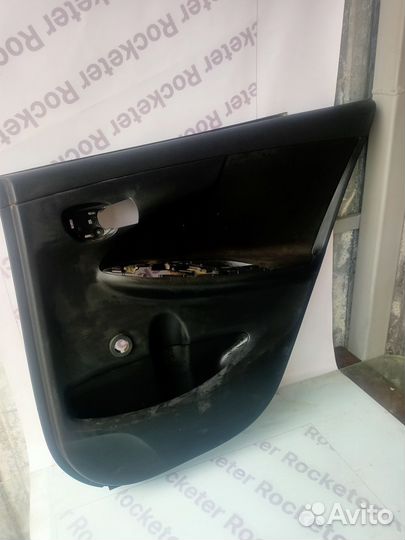 Обшивка двери задняя правая Toyota Corolla 150