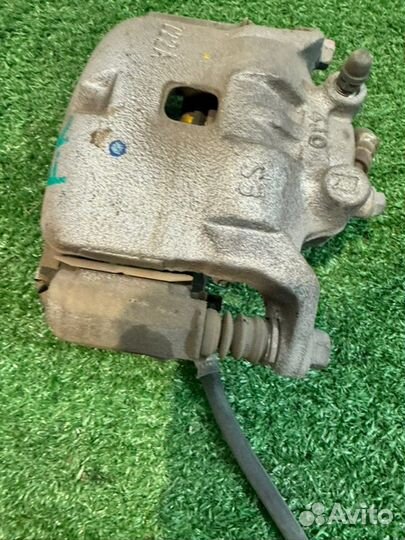 Суппорт тормозной передний правый Nissan Note E12