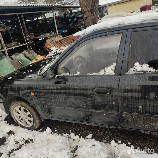 Дверь водительская Hyundai Accent чёрного цвета