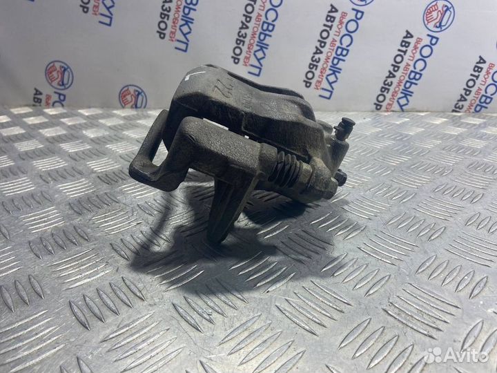 Суппорт тормозной передний левый Kia Rio 3