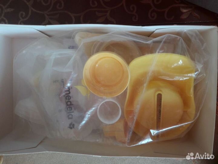 Молокоотсос medela