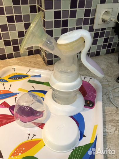 Молокоотсос Chicco Natural Feeling ручной с бутыло