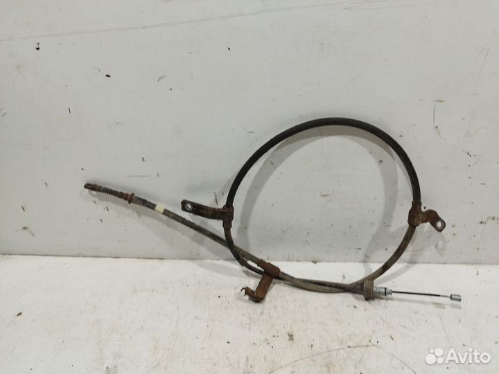 Трос стояночного тормоза левый RIO 2011-2017
