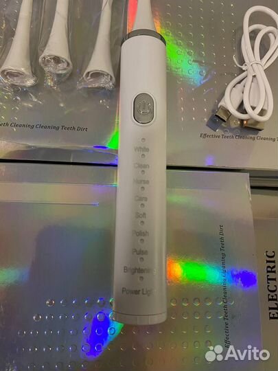 Электрическая зубная щетка