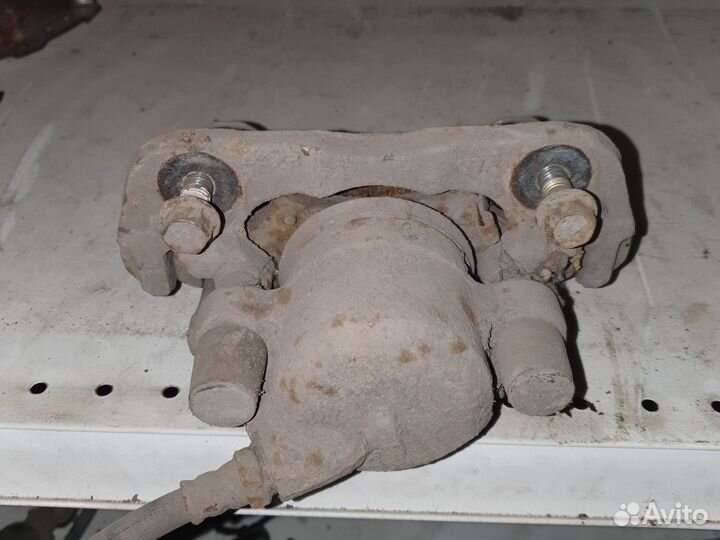 Суппорт тормозной Киа shuma R.L