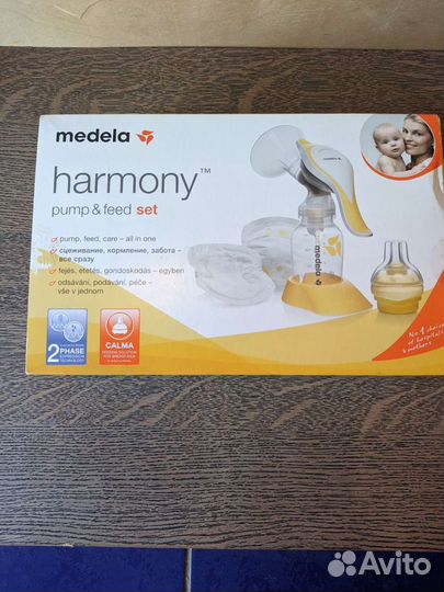 Молокоотсос medela ручной + 3 бутылочки + насадка