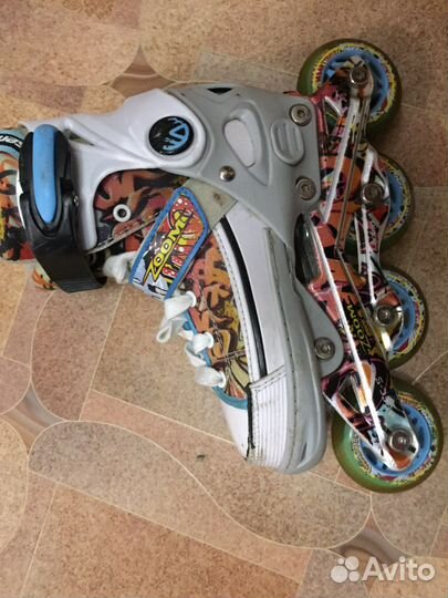 Роликовые коньки