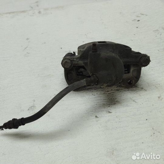 Суппорт тормозной передний левый Hyundai Lantra J1