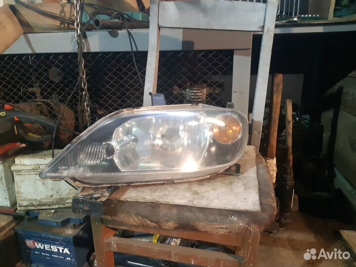 Фара mazda demio