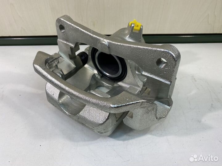 Суппорт тормозной TLC100 / LX470 задний правый