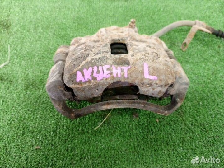 Суппорт тормозной передний левый Hyundai Accent