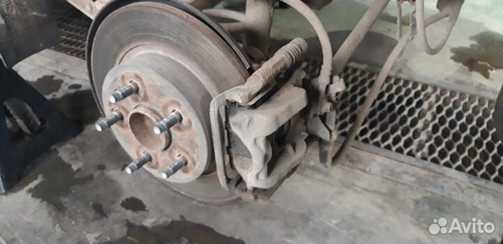 Суппорт тормозной задний левый. Опель астра J джей