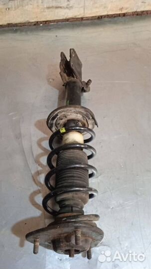 Стойка амортизатора передняя левая Mitsubishi Colt