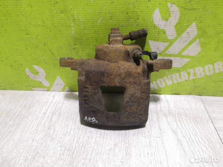 Суппорт передний левый Шевроле Ланос