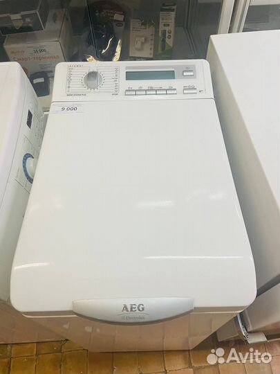 Стиральная машина AEG с вертикальной загрузкой