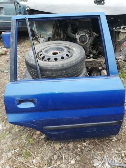 Дверь Мазда Демио 1