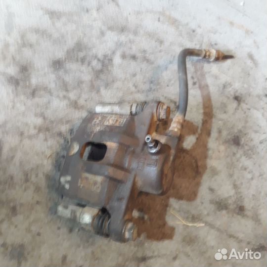 Суппорт левый задние Мицубиси Лансер 9