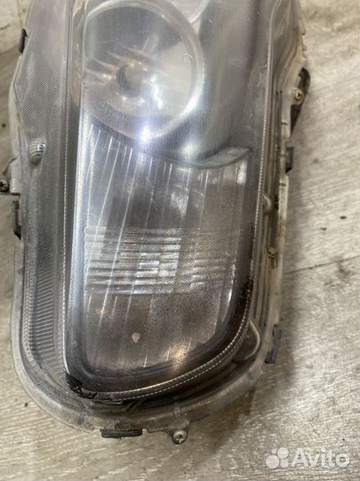 Фара левая Mitsubishi Lancer