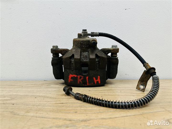 Суппорт тормозной передний левый Kia Cerato 3 2.0