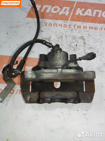 Суппорт тормозной передний левый Volkswagen Caddy