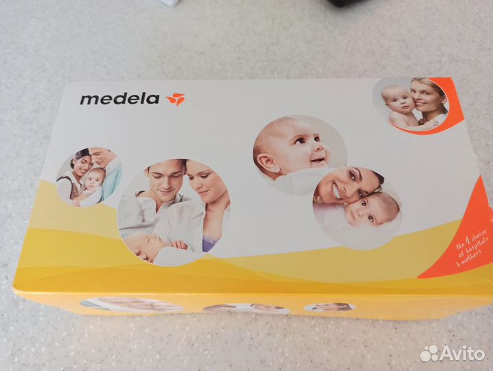 Молокоотсос medela новый