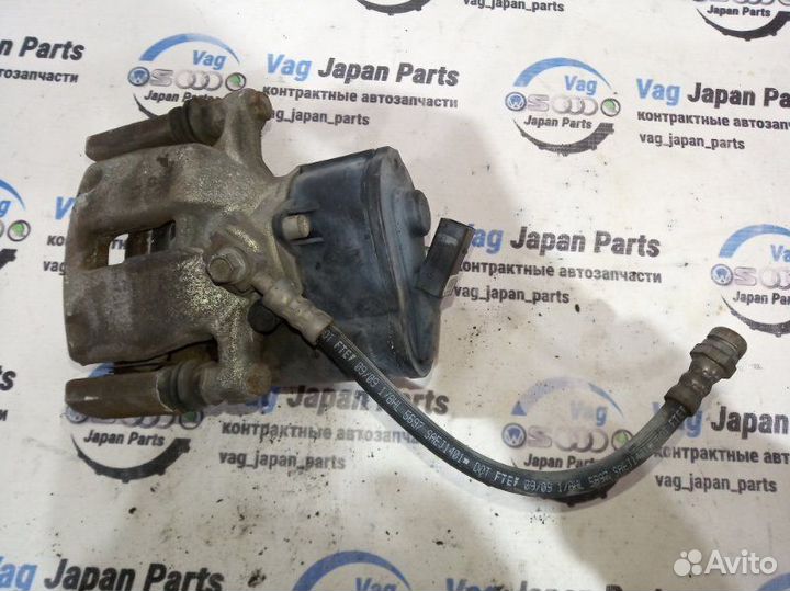 Суппорт тормозной задний правый Volkswagen Tiguan