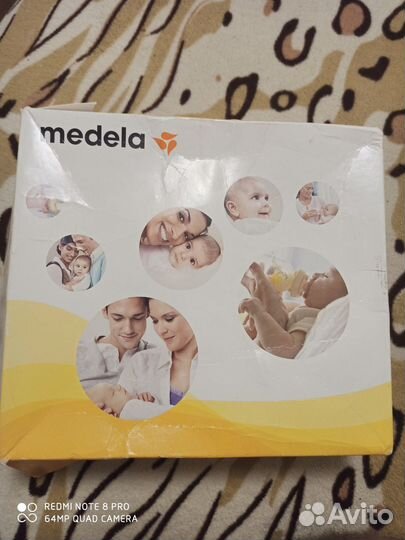 Молокоотсос medela электрический