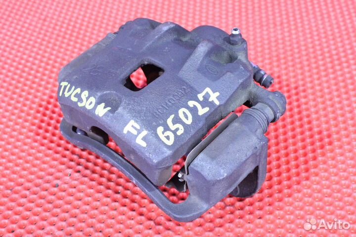 Суппорт тормозной передний левый Hyundai Tucson JM