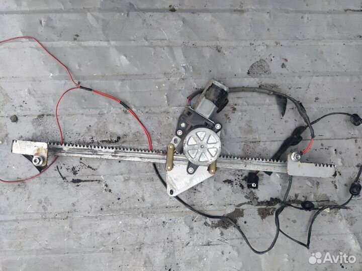 Стеклоподъемник передний левый Renault Logan