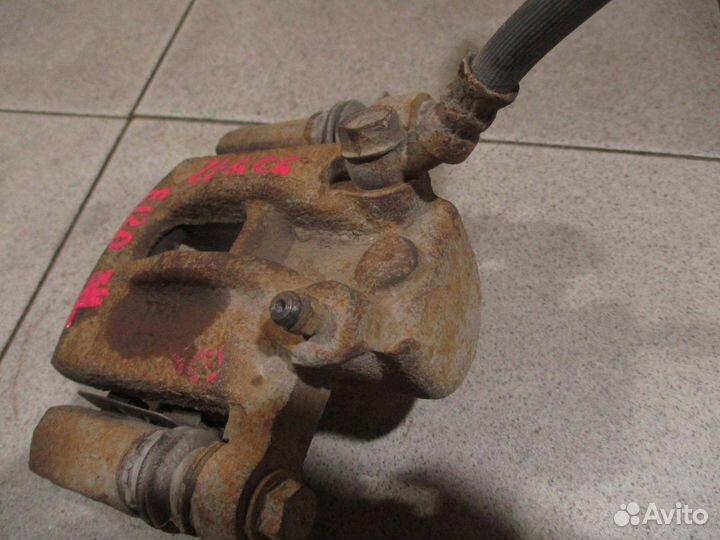 Суппорт задний левый Toyota Corolla (E120) 2000-2