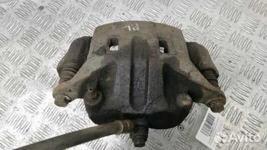 Суппорт тормозной передний левый nissan navara D40