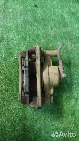 Суппорт тормозной передний левый Mazda Familia BJ