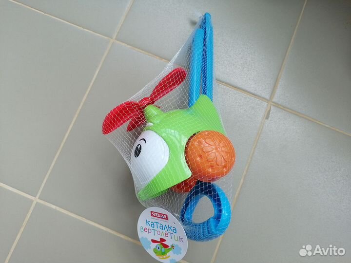 Игрушка каталка с ручкой