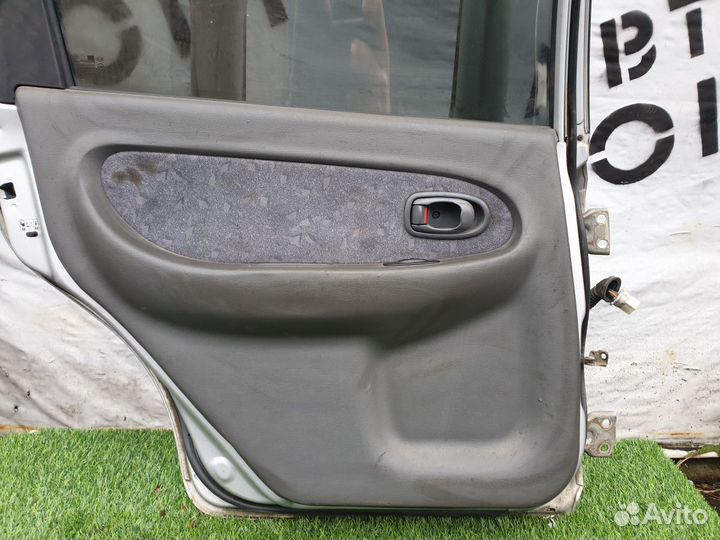Обшивка двери задней левой Kia Spectra