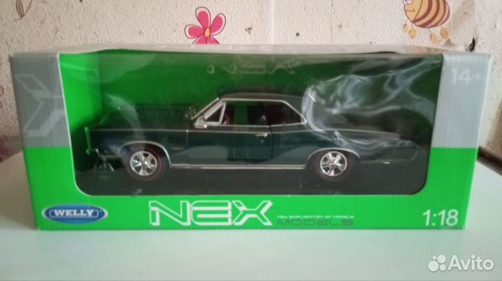Модель автомобиля Pontiac GTO 1966 Welly 1/18