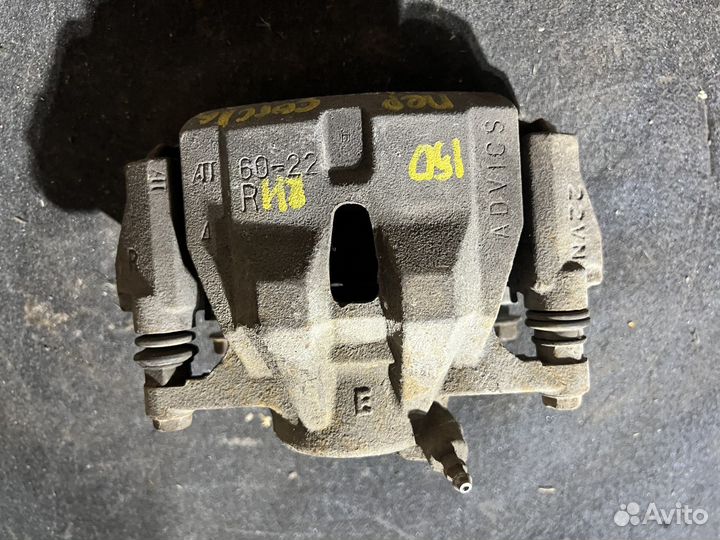 Тормозной суппорт передний Toyota Corolla 150