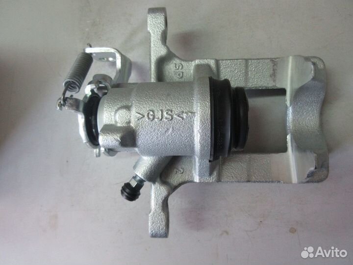 Суппорт задний тормозной правый Astra J