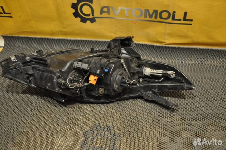 Фара левая mazda premacy crew