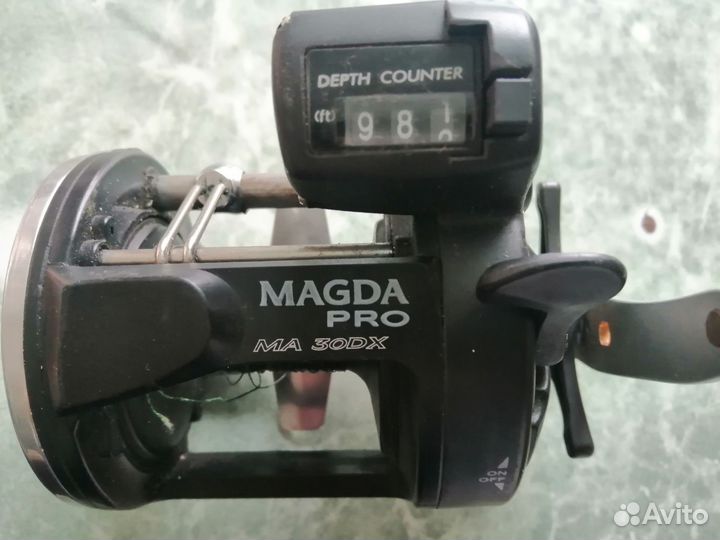 Катушка рыболовная инерционная